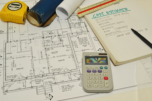 House blueprints reviewed for cost estimate