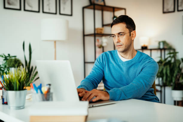 istock Mature businessman working from home during coronavirus pandemic 1302004122