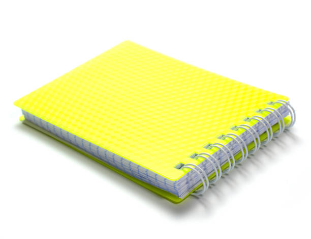 istock notepad with yellow cover and white spring-like sheet connector on white background 1302007922