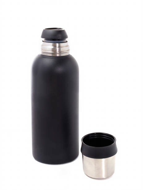 istock thermos with a dark texture and an open metal lid on the table. isolated on white background. travel and hiking, hot tea and coffee. 1302008633