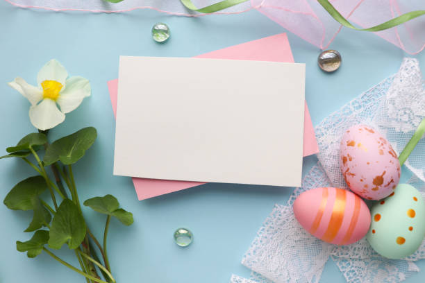 istock Easter greeting card mockup. spring flowers, willow twigs and Easter eggs 1302008698