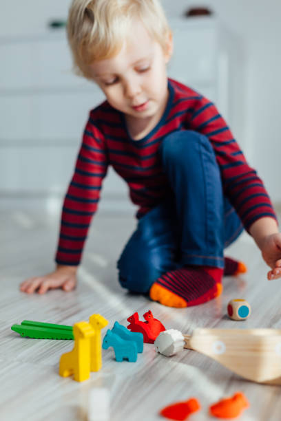 istock Child Playing With Toys 1302012082