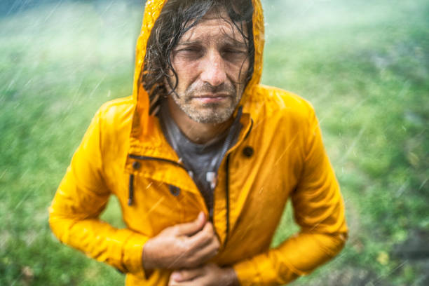 istock Portrait of a wet man under the rain 1302017383
