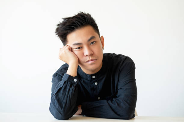 istock bored guy portrait professional crisis asian man 1302017391