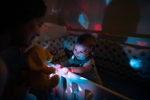 istock Bbaby boy love his luminous toy 1302017458