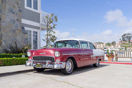 Newport Beach, California, USA - February 13, 2021: this image shows a 1955 Chevy Bel Air parked.