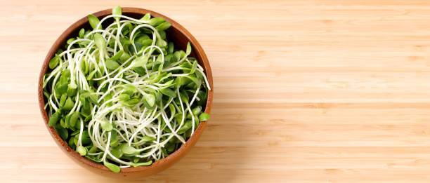 istock Healthy vegetable salad on wooden floor, top view 1302032033