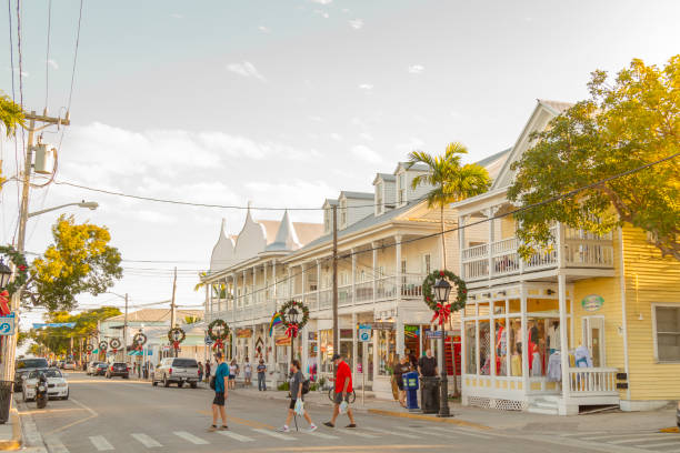 In Key West, United States businesses occupy wooden historic buildings that look like large houses on Duval Street.
