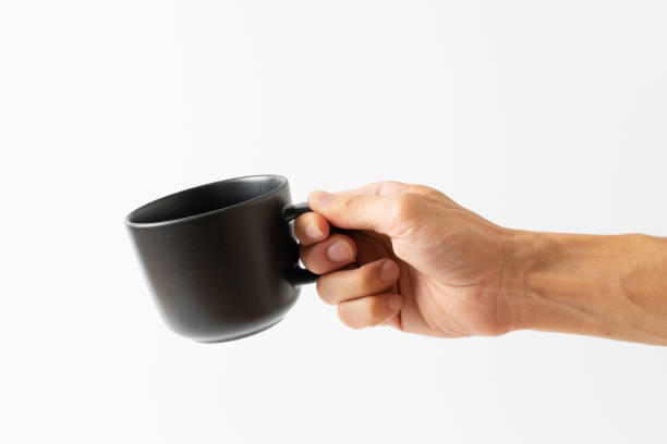 istock hand holding black color cup coffee on white background 1302036369