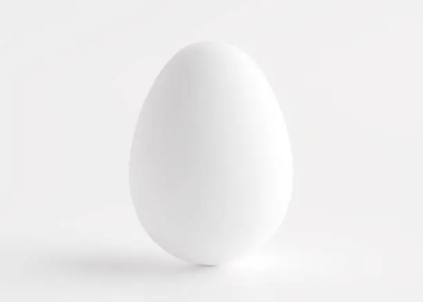 Photo of Silver egg close-up on a white background. Easter holiday. 3D rendering and 3D illustration.