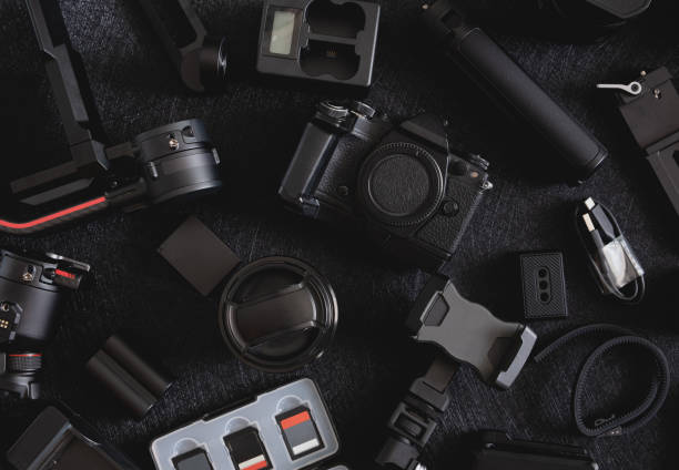 istock top view of work space photographer with digital camera, Gimbal Stabilizers and camera accessory 1302047439