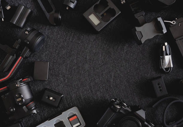 istock top view of work space photographer with digital camera, Gimbal Stabilizers and camera accessory 1302047442