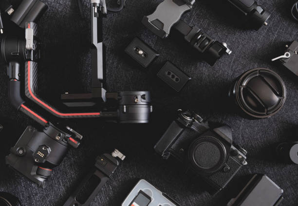 istock top view of work space photographer with digital camera, Gimbal Stabilizers and camera accessory 1302047451