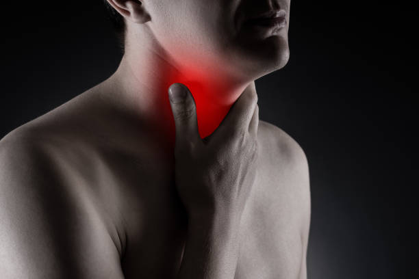 sore throat, men with pain in neck on black background - surprise color image gasping the human body imagens e fotografias de stock