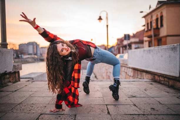 A young woman playing in the streets
