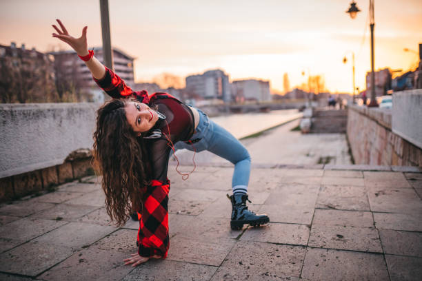 istock A young woman playing in the streets 1302049554