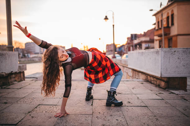 istock A young woman playing in the streets 1302049561