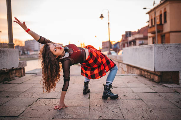 istock A young woman playing in the streets 1302049578