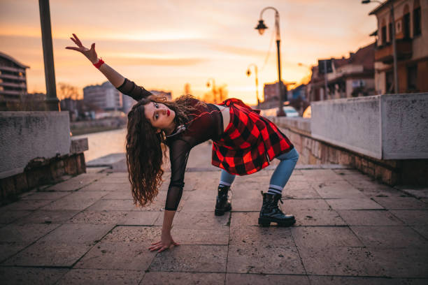 istock A young woman playing in the streets 1302049918