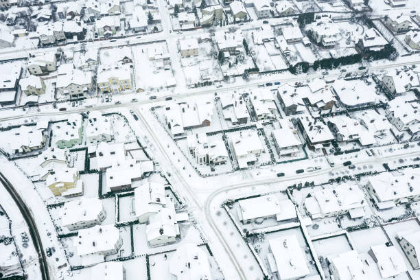 istock suburban residential district after snowfall at winter cloudy day. drone point view 1302050389