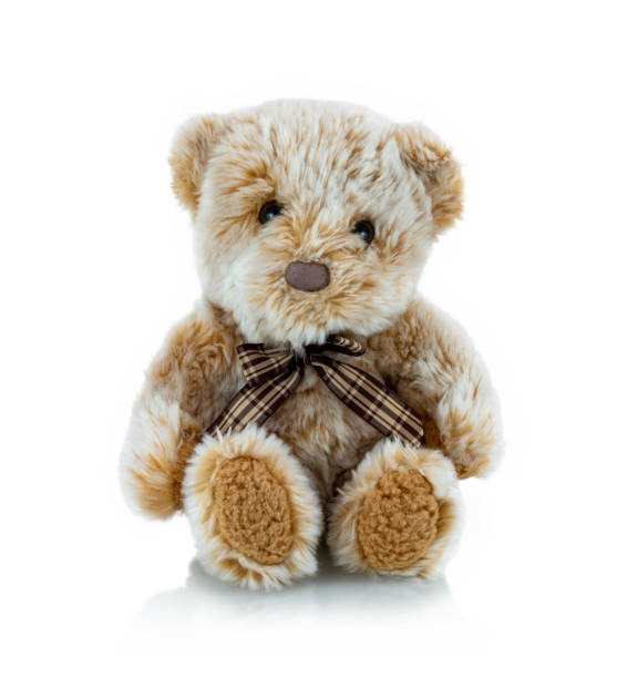 istock Teddy bear plushie doll isolated on white background with shadow reflection. Plush stuffed puppet on white backdrop. Light brown fluffy toy for children. Cute furry animal plaything. 1302064447
