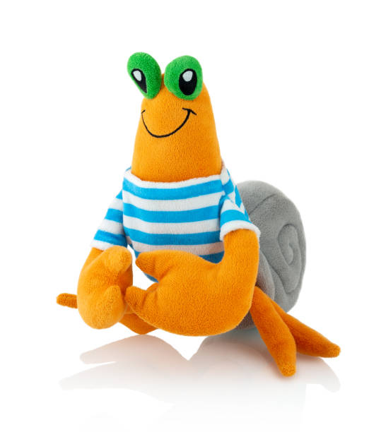 istock Strawberry land hermit crab plushie doll isolated on white background with shadow reflection. Plush stuffed puppet on white backdrop. Fluffy crab toy for children. Cute furry animal plaything for kids 1302064461