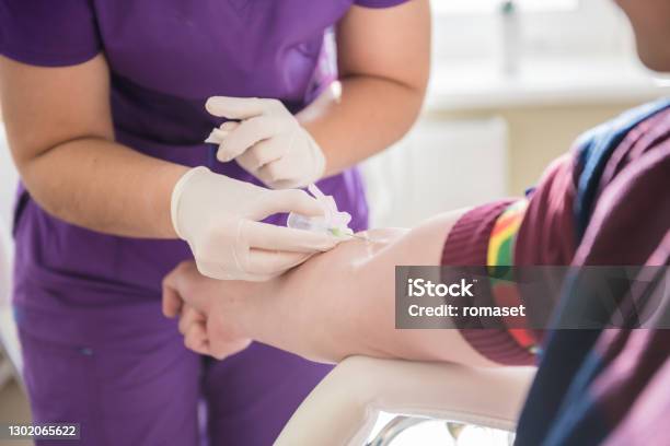 Nurse Taking A Patients Blood Sample At Lab Stock Photo - Download Image Now - Blood Donation, Nurse, Color Swatch