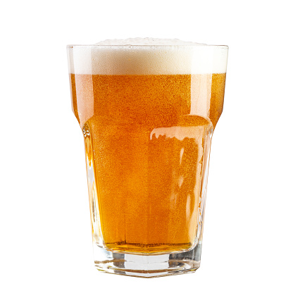 Amber beer on white background, nice frothy head and condensation