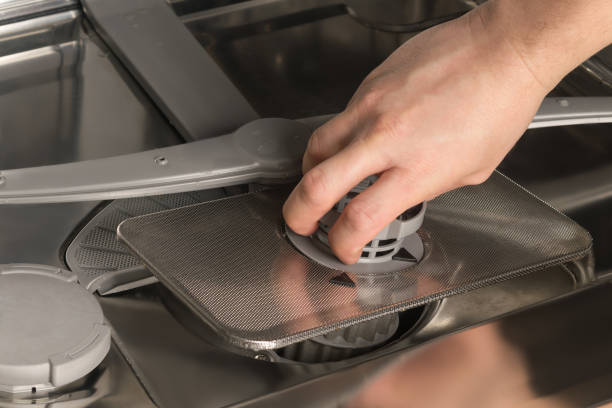 istock servicing and repairing household dishwashers, close-up 1302070082