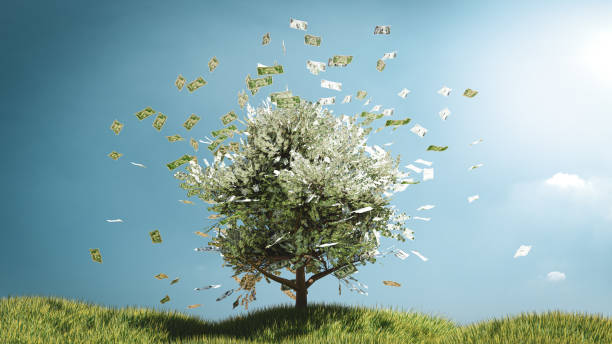 istock 3D illustrations. Tree money on grass field with blue sky. Money concept. 1302070931
