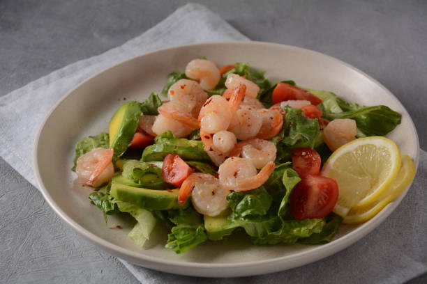istock Avocado salad with shrimps and cherry tomatoes. 1302072892