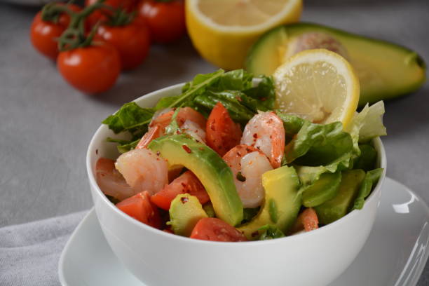 istock Avocado salad with shrimps and cherry tomatoes. 1302072897