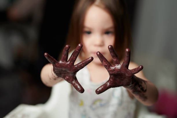 istock Girl child palm hands painted 1302075070