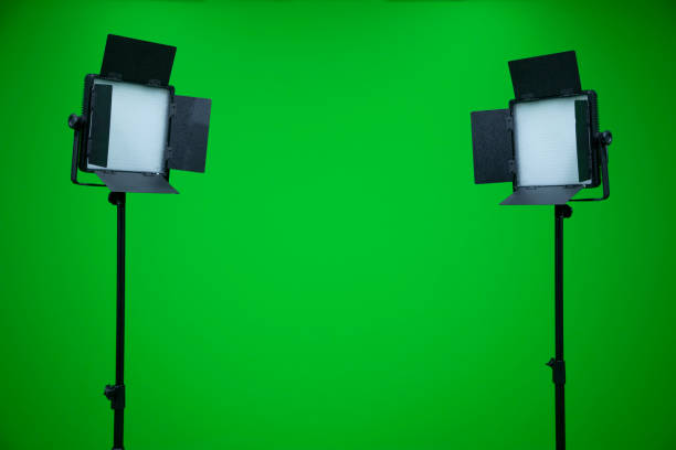 istock Green screen television studio with two fill lights. Lights are on in chroma studio 1302075988