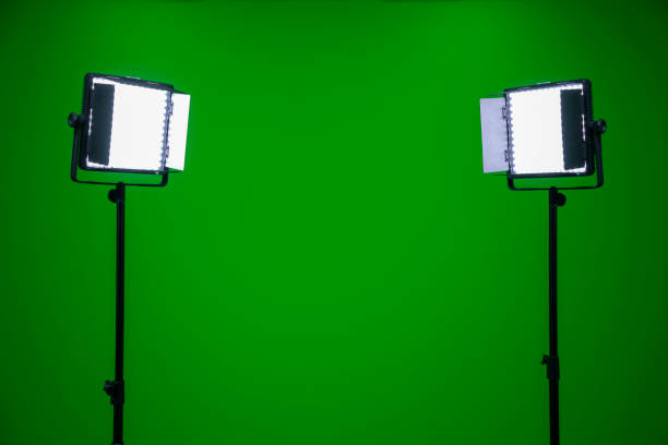 istock Green screen television studio with two fill lights. Lights are on in chroma studio 1302076001