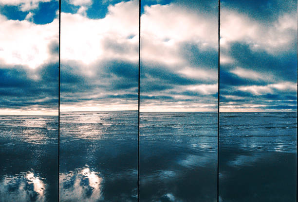 Coastline on a sunny cold day, 35mm Reflections in the sand by the sea, Lomography 35mm supersampler dorset england photos stock pictures, royalty-free photos & images
