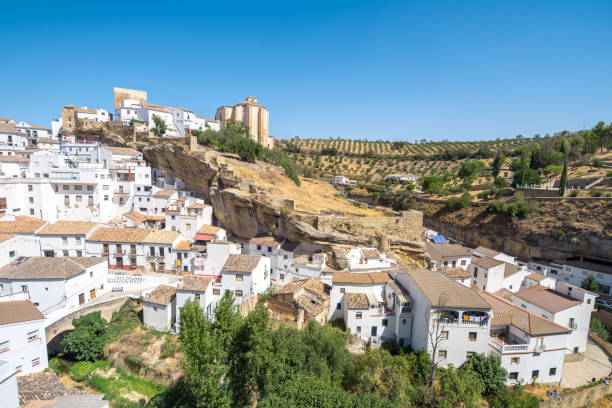 istock setenil de las bodegas is an andalusian town surrounded by a gorge 1302080447