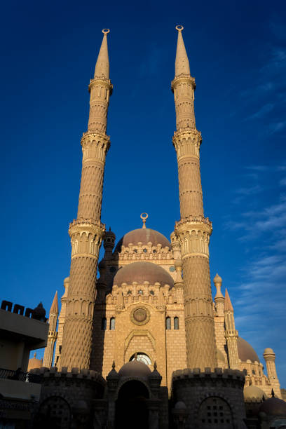 istock Beautiful large Islamic mosque at the sky background 1302081571