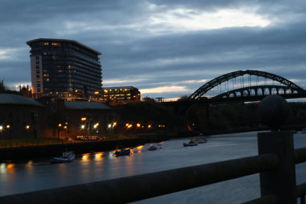 istock Dark blue sky white cloud on the drak curve bridge and modern building 1302081663