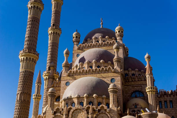 istock Beautiful large Islamic mosque at the sky background 1302082232