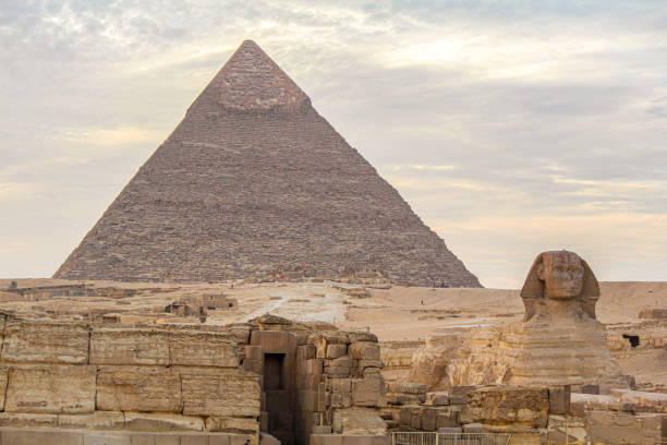 istock Sphinx sculpture and the Cheops pyramid in Giza, Egypt 1302082523