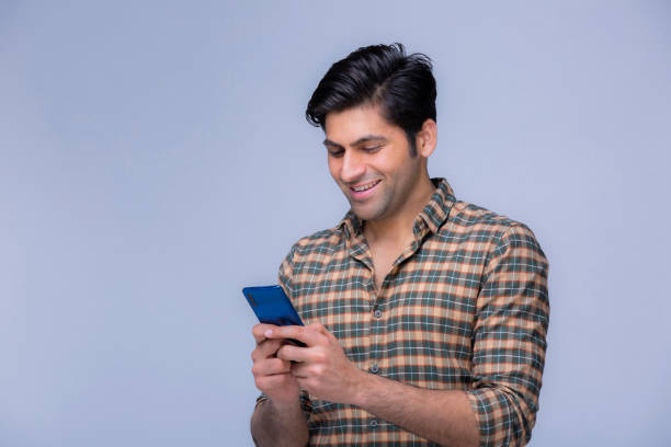 istock young men using phone stock photo 1302082843