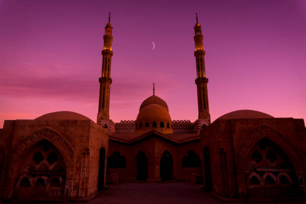 istock Beautiful large Islamic mosque at the sunset sky background 1302085517