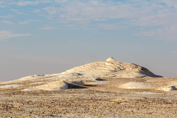 Bizarre sandstone formations in the white desert, early morning Bizarre limestone formations in the Lybian desert, white desert near Farafra, Egypt egypt horizon over land sun shadow stock pictures, royalty-free photos & images