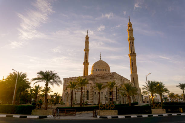 istock Beautiful large Islamic mosque at the sky background 1302086904