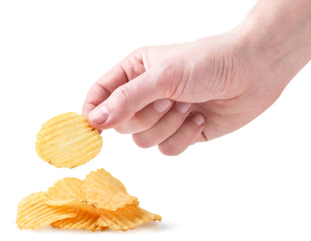 istock Male hand takes potato chips on a white background. Isolated 1302088739