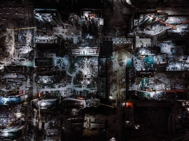 istock Drone Point View of Working Construction Site at Night 1302089033