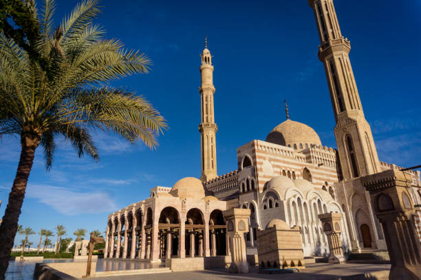 istock Beautiful large Islamic mosque at the sky background 1302089137
