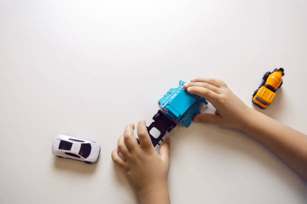 istock boy child in a blue T shirt sits at a table 1302089749