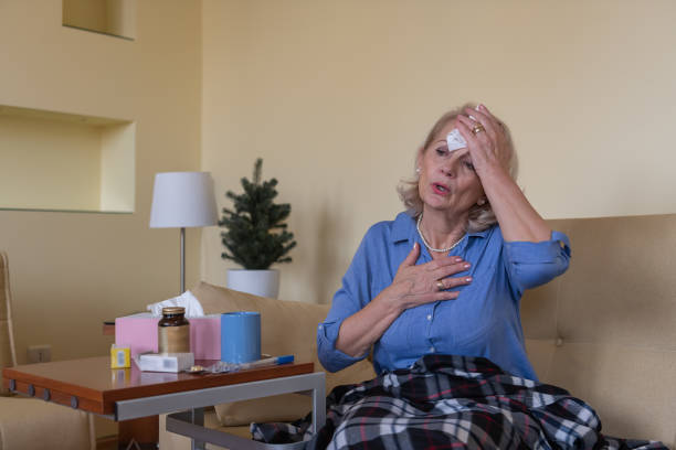 istock Sick Senior Woman Caught a Flu Virus, has a High Temperature and Sweating. 1302092899